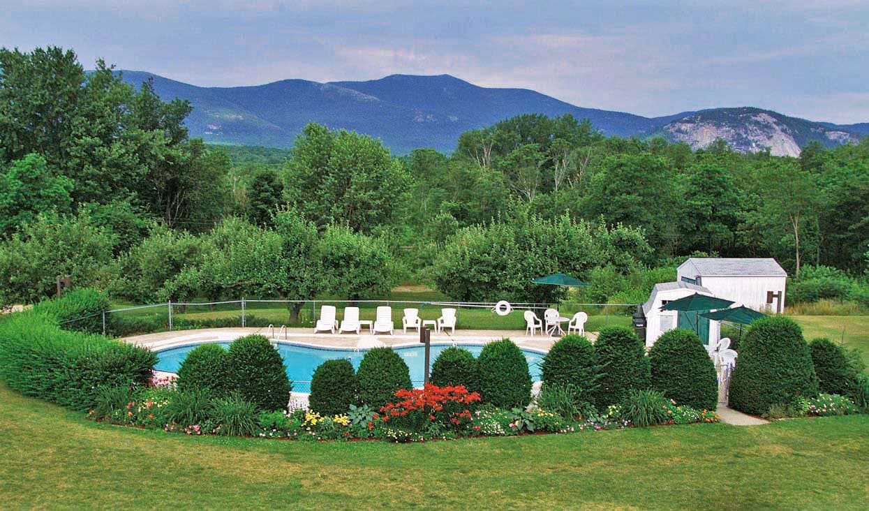 Outdoor heated pool with White Mountains views at Briarcliff Motel